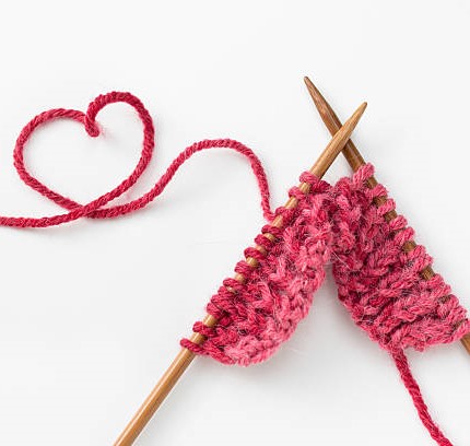 Incomplete knitting project with wooden needles